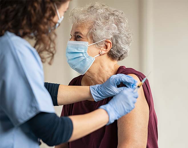 elderly lady getting vaccine
